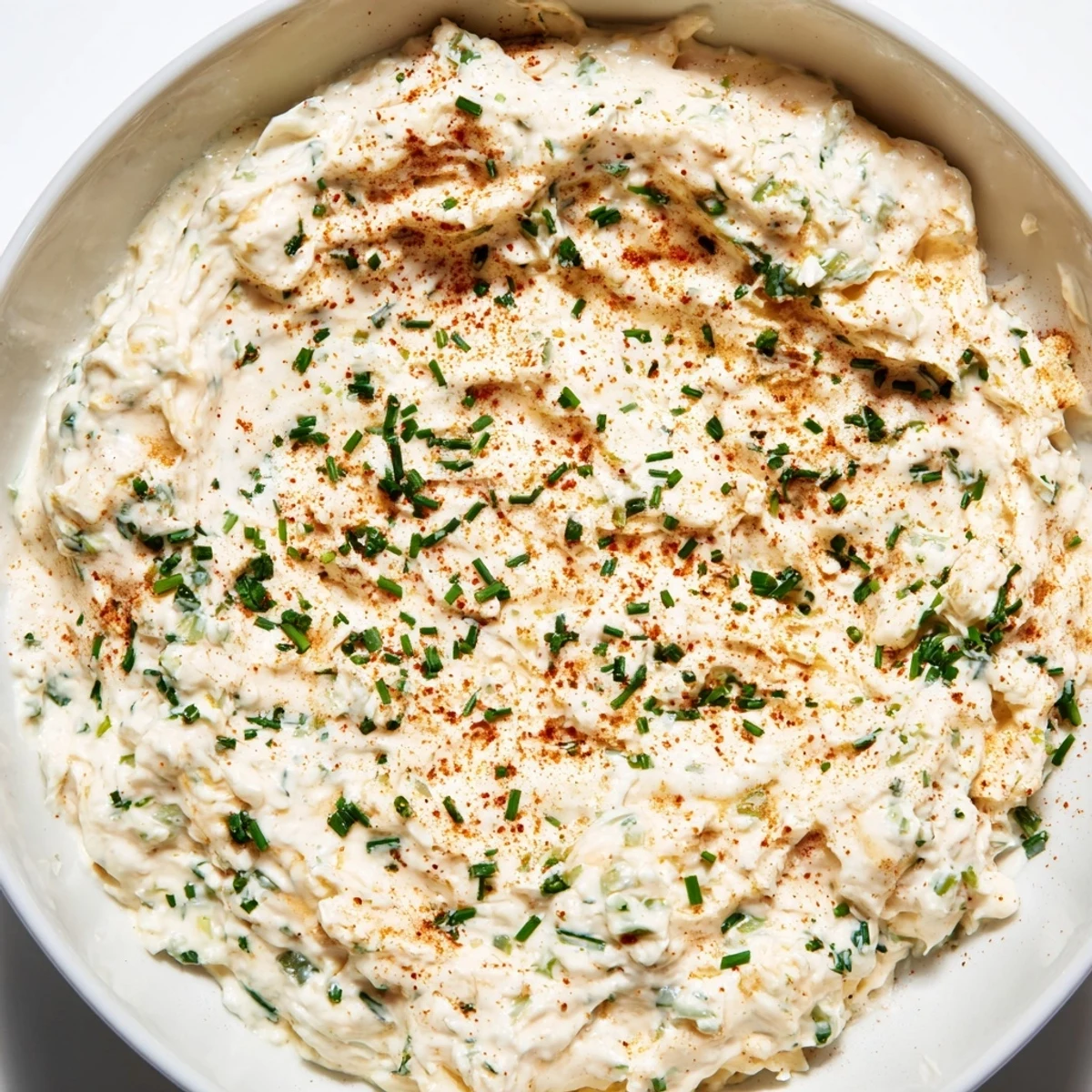 The rich, chilled Creamy Dip Bowl is surrounded by colorful vegetable crudités for an easy party appetizer.