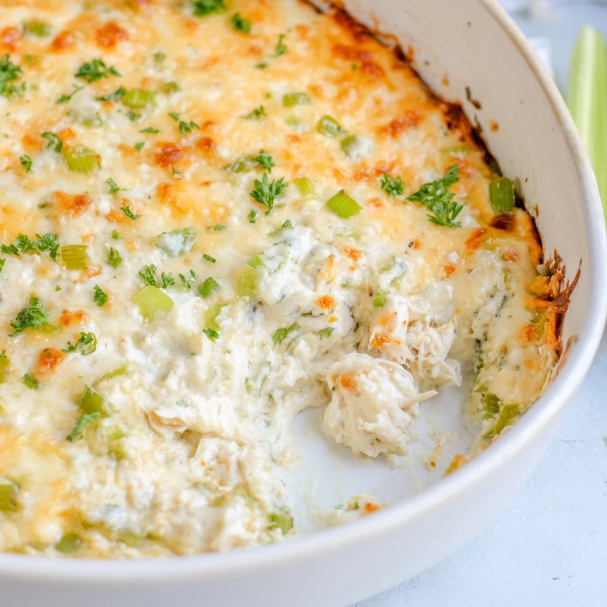 Cajun Crab Dip with Crackers emerges from the oven golden and bubbling, ready for a festive party appetizer spread.