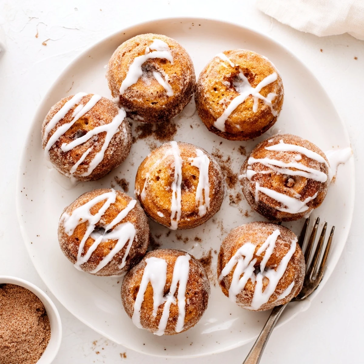 Warm fried donuts filled with spiced pumpkin mixture and dusted with crunchy cinnamon sugar coating