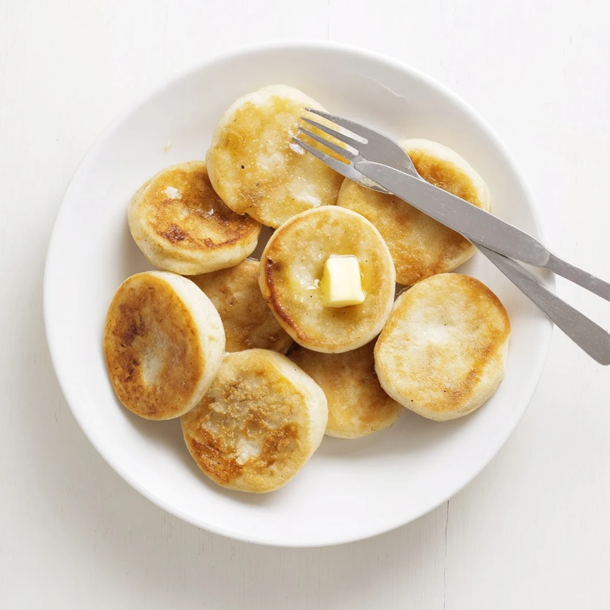 Homemade Irish potato cakes stacked high showcasing golden crust and fluffy mashed potato interior
