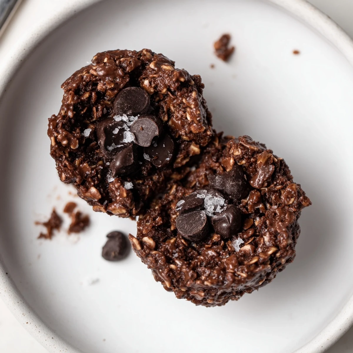 Close-up of chilled Brownie Protein Bites with glossy chocolate chips, nutty aroma