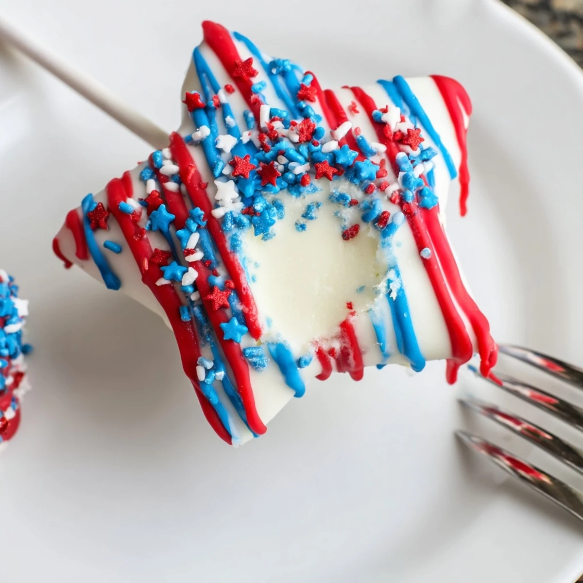 Fourth Of July Star Cheesecake Pops: creamy star bites dipped in chocolate