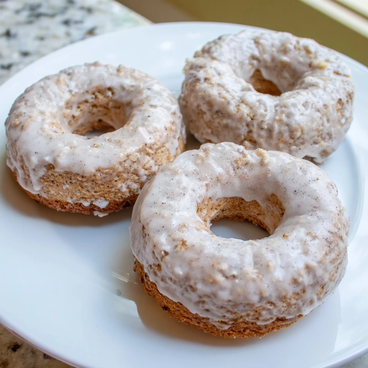 Freshly baked Banana Donuts steaming beside coffee, cinnamon scent and tender texture