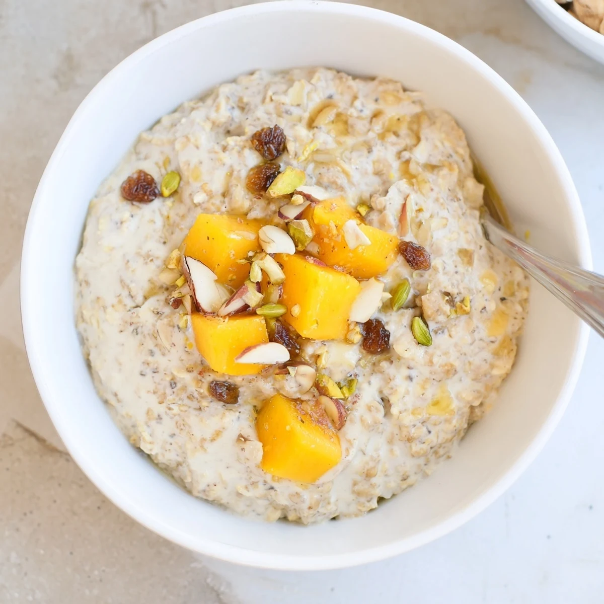Aromatic Indian Cardamom Overnight Oats, silky texture, topped with chopped pistachios