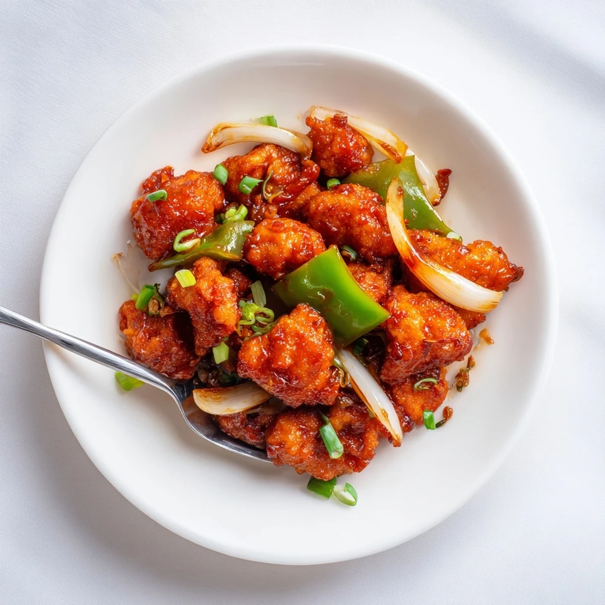 Flavorful Chilli Chicken Indo Chinese, crispy bites tossed in spicy tangy sauce