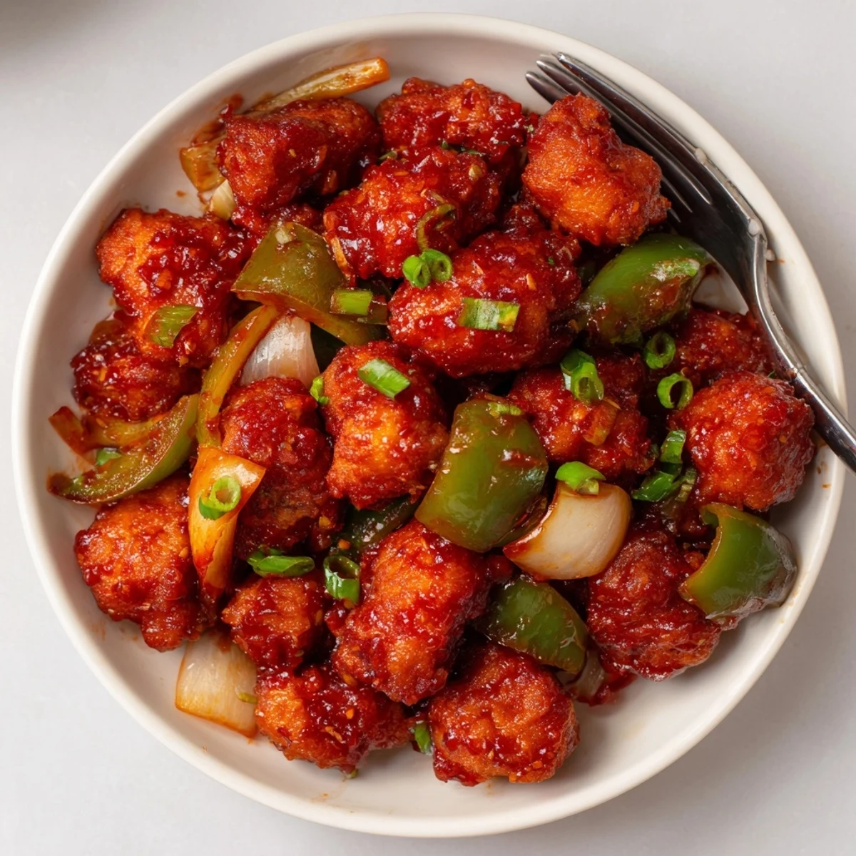 Sizzling wok of Flavorful Chilli Chicken Indo Chinese served with fried rice