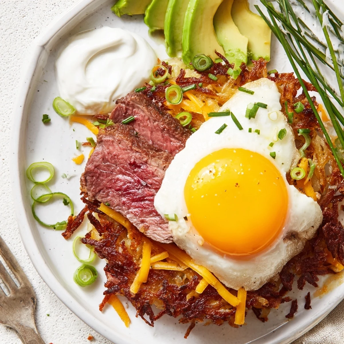 Crispy Loaded Steak Egg Hash Brown Stacks plated for weekend brunch