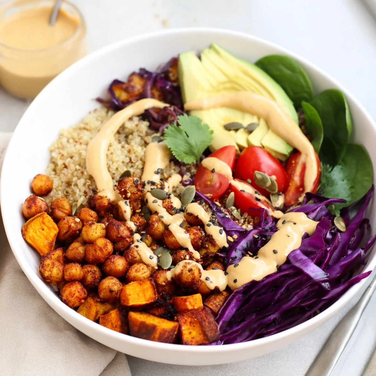Golden roasted vegetables and spiced chickpeas fill this nourishing plant-based Buddha Bowl