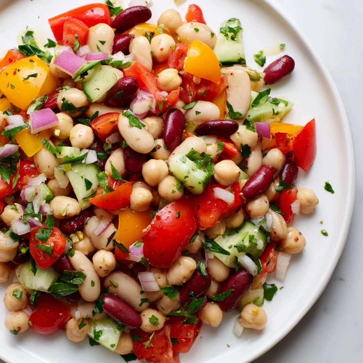 Italian bean salad bursting with crisp bell peppers juicy tomatoes and herb dressing