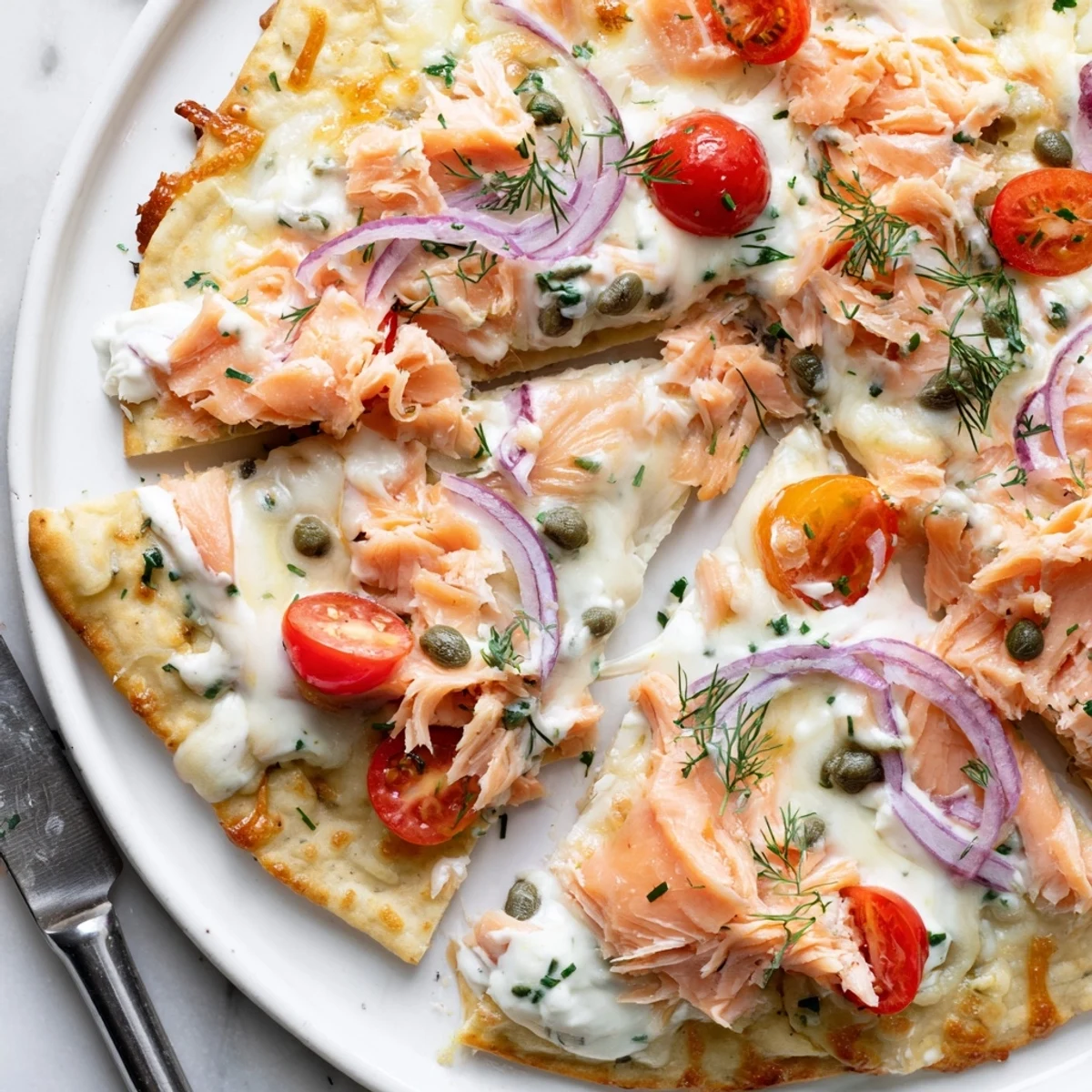 Crispy salmon tortilla pizza fresh from oven with melted golden mozzarella cheese