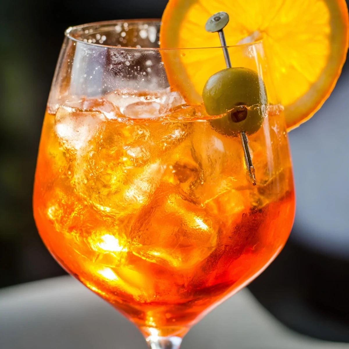 Vibrant Spritz Recipes drink featuring Prosecco, Aperol, and a slice of fresh orange  