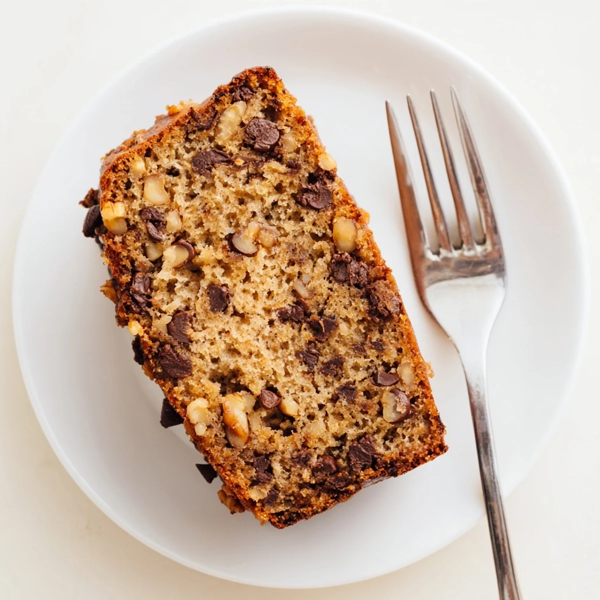 Rich one bowl banana bread with melted chocolate chips on top