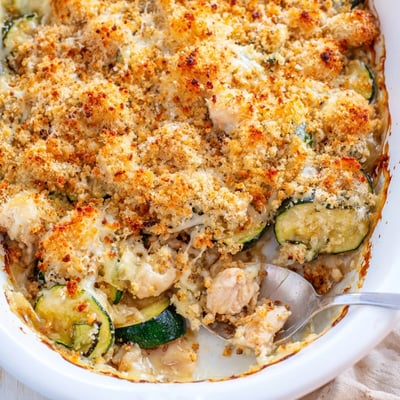 Freshly baked golden brown Chicken Zucchini Bake with melted mozzarella and Parmesan served hot from the oven. 