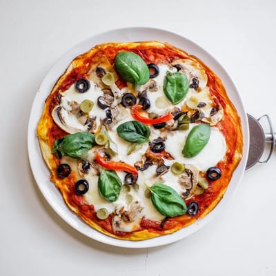 Savory Italian pizza topped with melted mozzarella and vibrant red tomato sauce.  